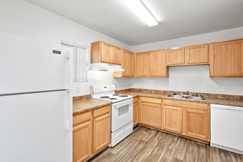 Kitchen with white fridge and cabinet